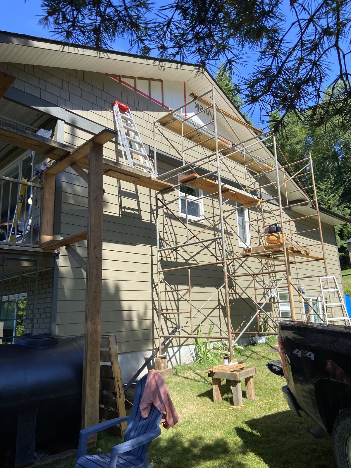 House with scaffolding during a siding job
