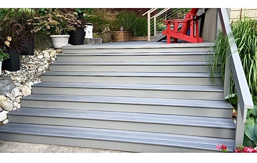 Wide composite stairs leading to a deck