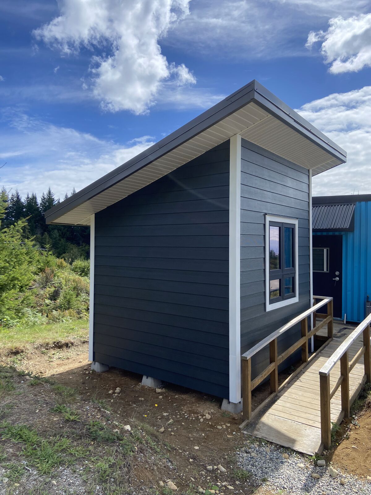 Side view of a finished bunkie with ramp